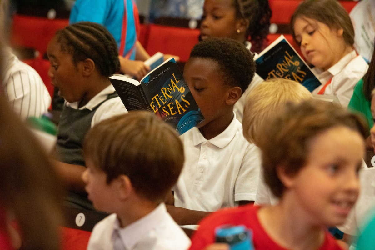 Pupils in audience of a creative writing festival reading Eternal Seas books