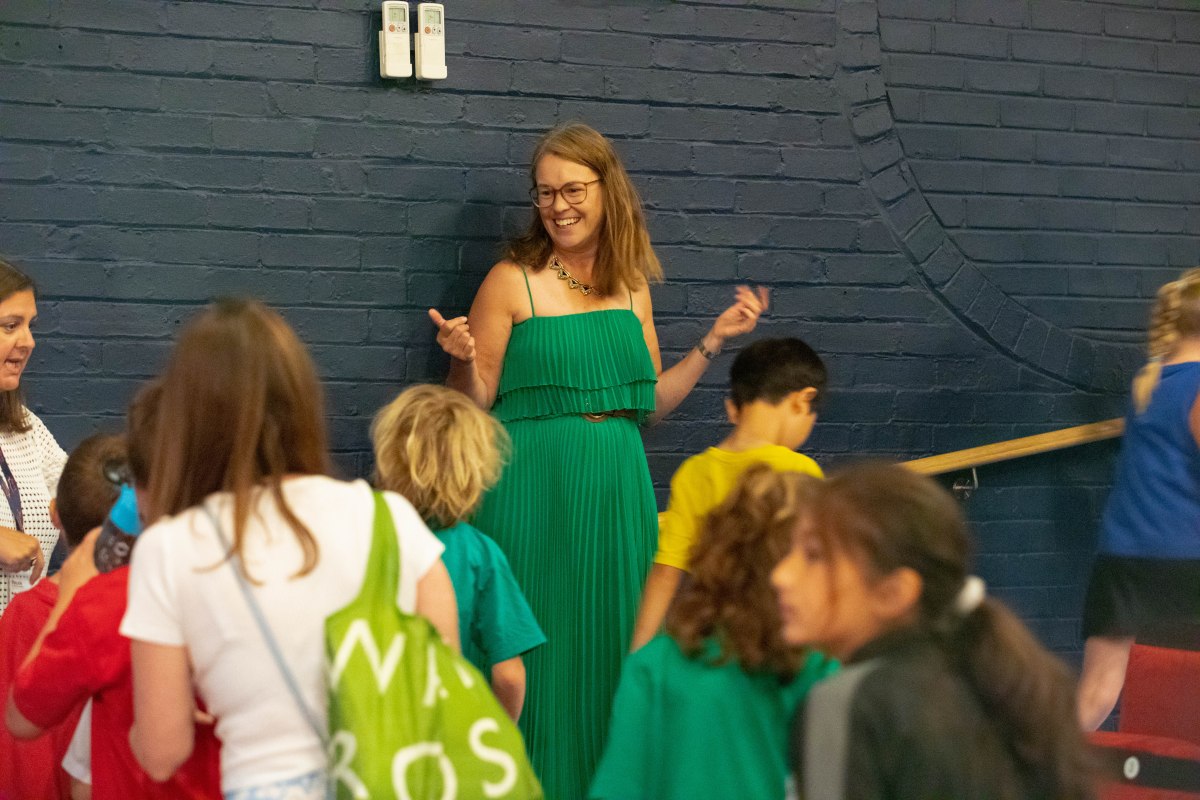 Lexi Rees on stage at an author event